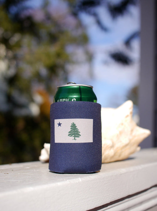 Navy blue can Koozie with two color screen printed image of Original 1901 Maine Flag sitting on front porch railing